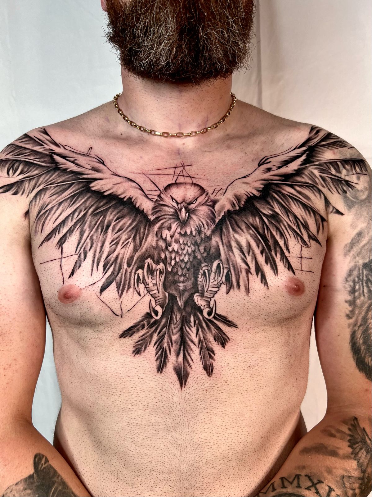Eagle chest tattoo with spread wings