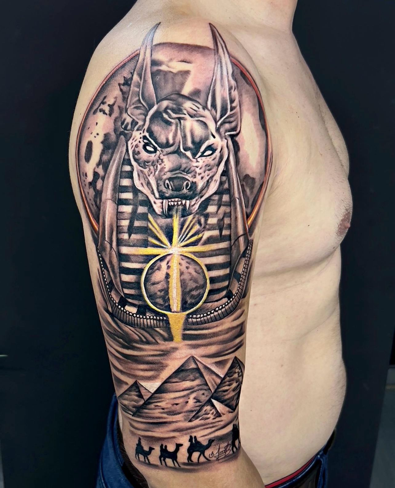 Egyptian themed sleeve tattoo with Anubis